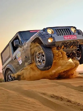 Jeep safari adventure on golden sand dunes of Jaisalmer Rajasthan